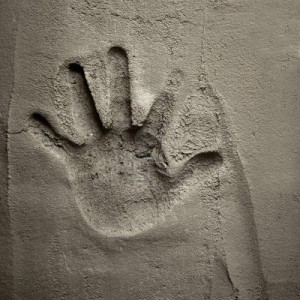 13601644-hand-print-on-cement-mortar-wall-with-shadow-relief